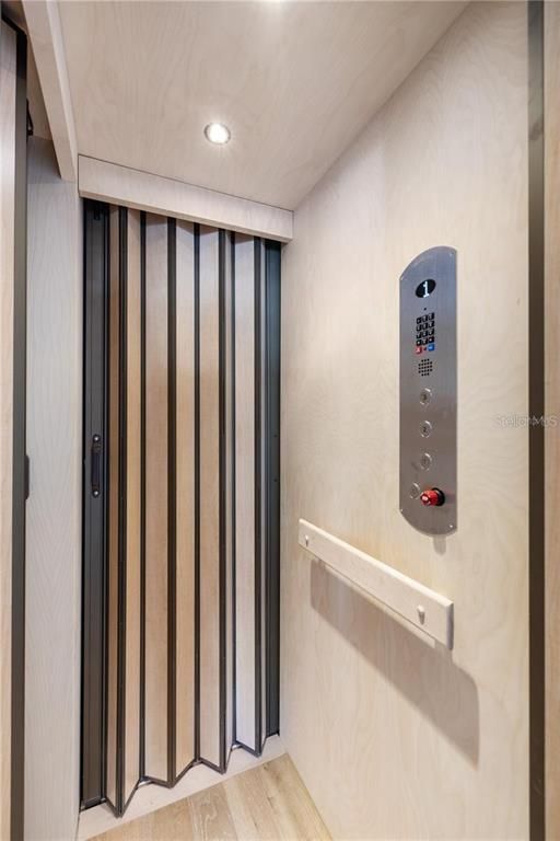 Elevator, Interior, Recessed Lighting, Wood Texture Flooring