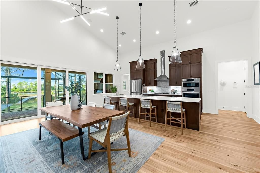 Dining room, Interior, Kitchen, Pendant Lights, Recessed Lighting, Stainless Steel Appliances, Wood Texture Flooring