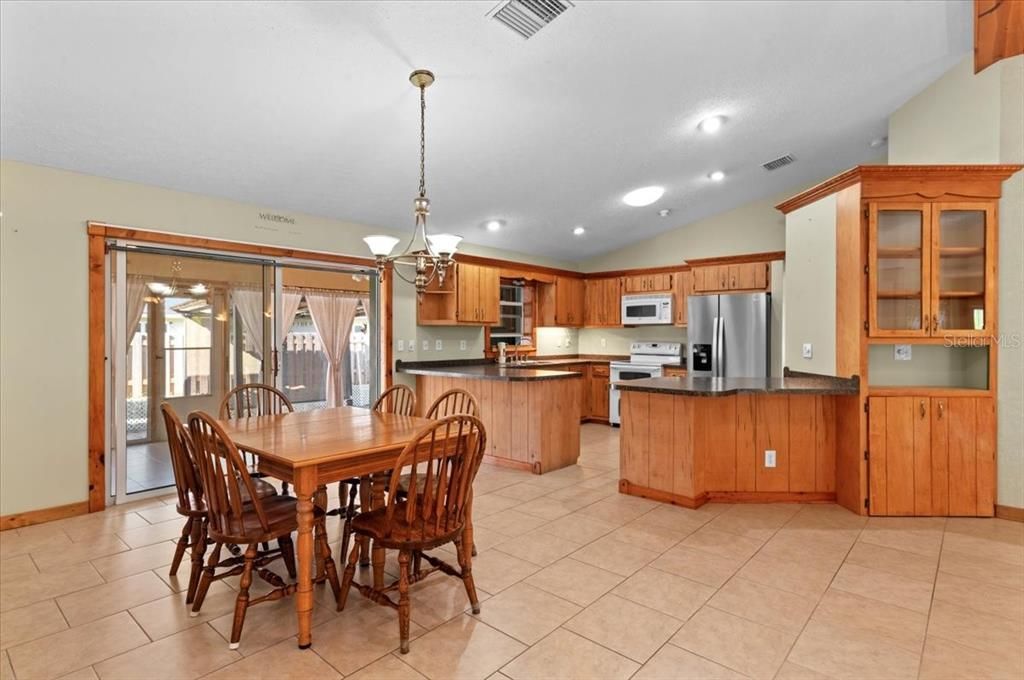 Chandelier, Dining room, Interior, Kitchen, Pendant Lights, Recessed Lighting, Stainless Steel Appliances
