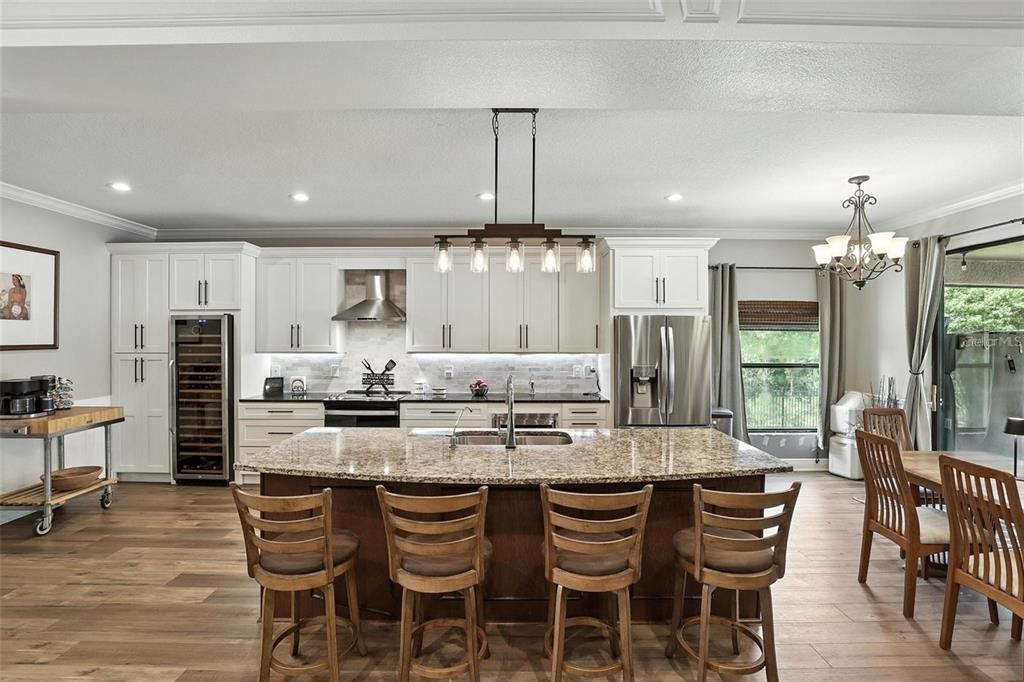 Chandelier, Interior, Kitchen, Pendant Lights, Recessed Lighting, Stainless Steel Appliances, Wood Texture Flooring