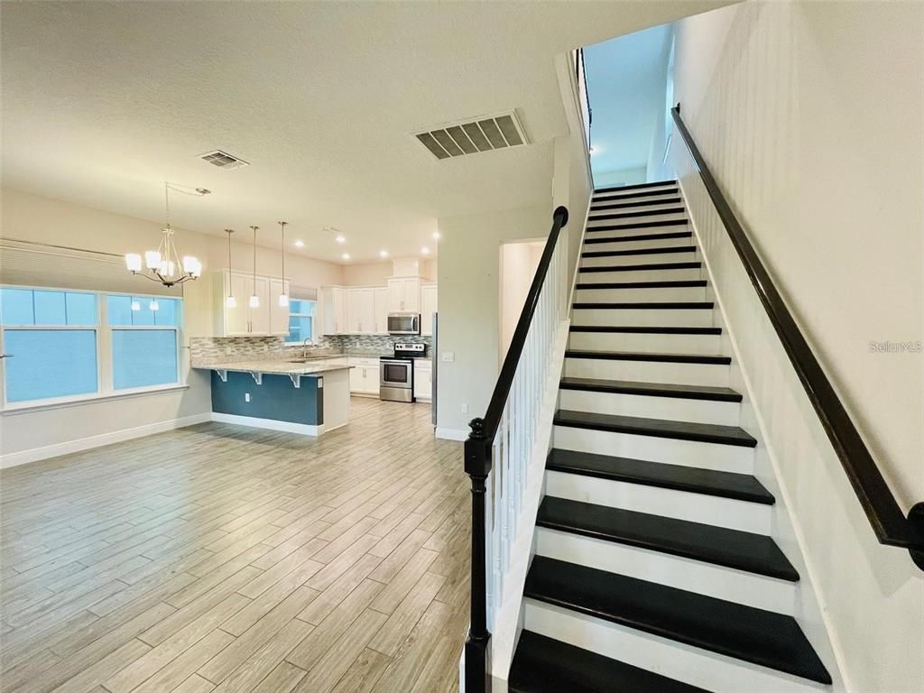 Chandelier, Interior, Kitchen, Pendant Lights, Recessed Lighting, Stainless Steel Appliances, Wood Texture Flooring