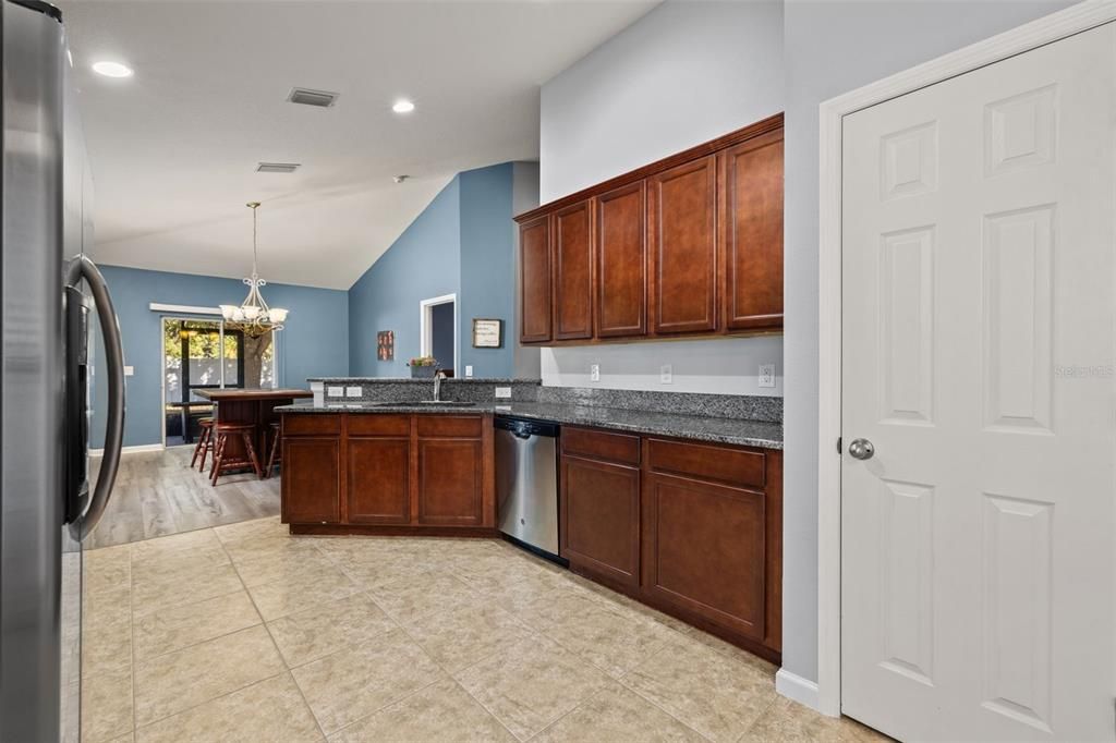 Chandelier, Dining room, Interior, Kitchen, Pendant Lights, Recessed Lighting, Stainless Steel Appliances, Wood Texture Flooring