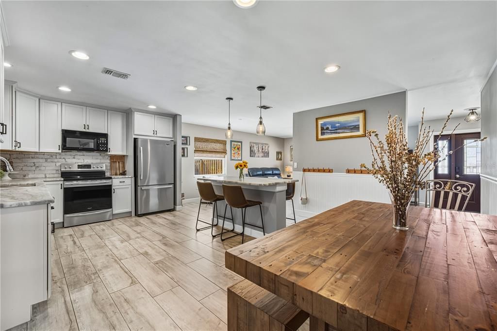 Dining room, Interior, Kitchen, Pendant Lights, Recessed Lighting, Stainless Steel Appliances, Wood Texture Flooring