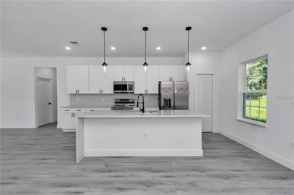 Interior, Kitchen, Pendant Lights, Recessed Lighting, Stainless Steel Appliances, Wood Texture Flooring