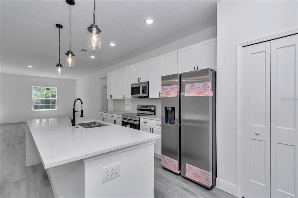 Interior, Kitchen, Pendant Lights, Recessed Lighting, Stainless Steel Appliances, Wood Texture Flooring