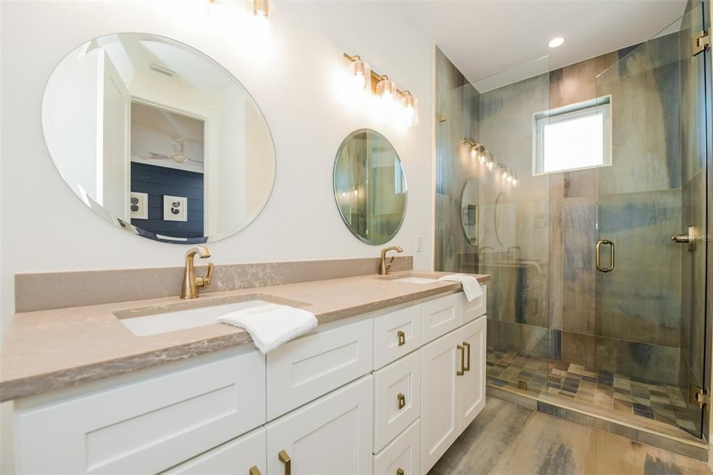 Bathroom, Dual Sink Vanities, Glass Shower, Interior, Recessed Lighting, Wood Texture Flooring