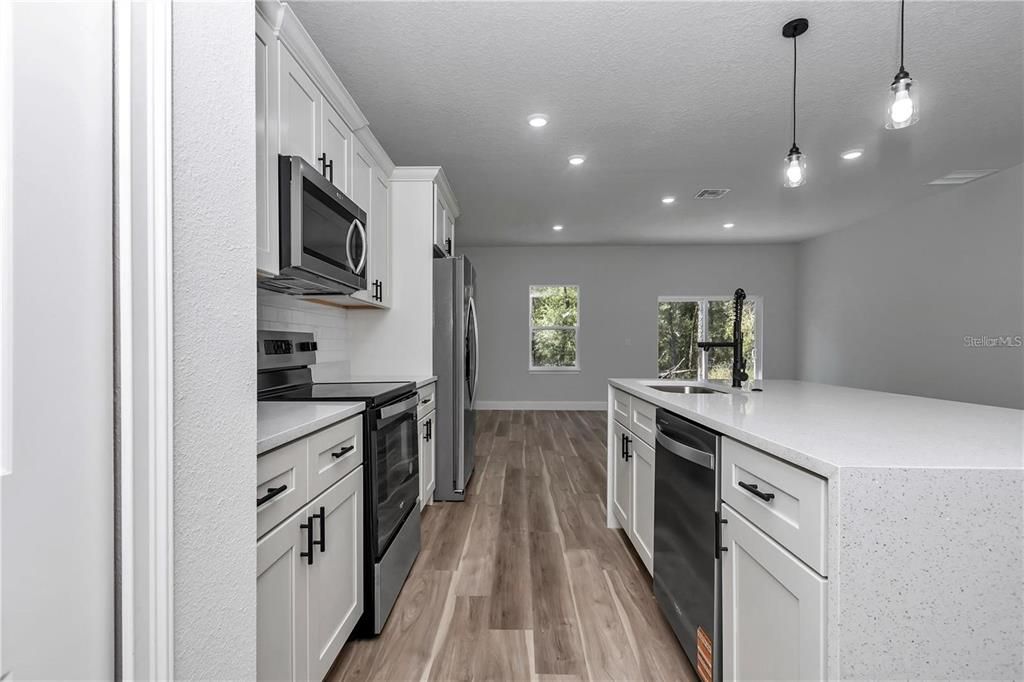 Interior, Kitchen, Pendant Lights, Recessed Lighting, Stainless Steel Appliances, Wood Texture Flooring