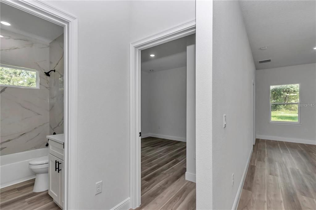 Bathroom, Interior, Marble Walls, Recessed Lighting, Wood Texture Flooring