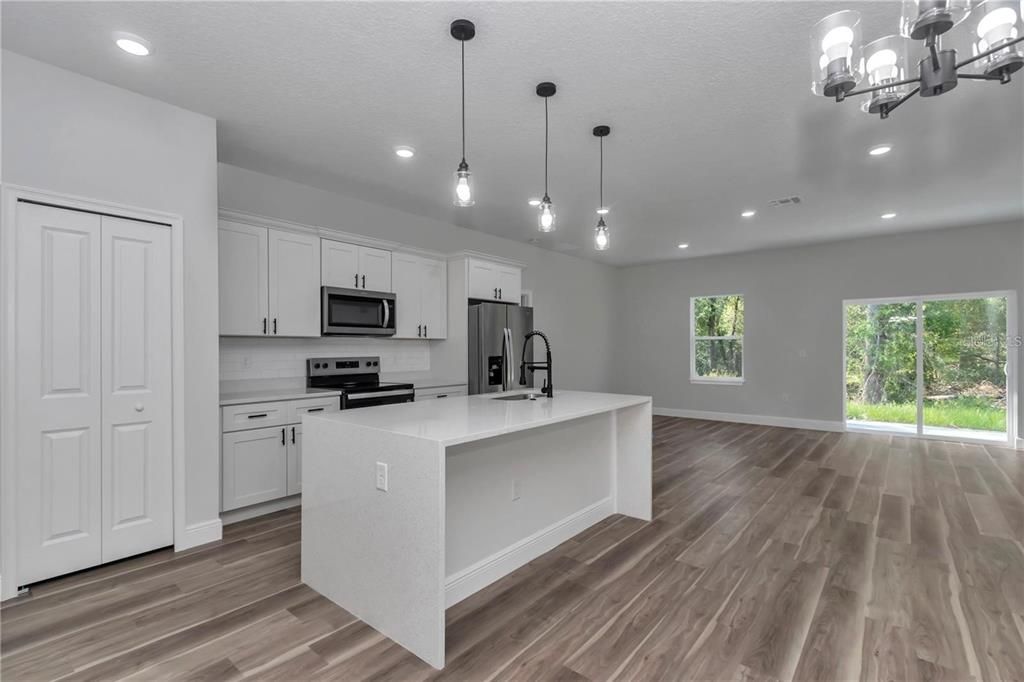 Interior, Kitchen, Pendant Lights, Recessed Lighting, Stainless Steel Appliances, Wood Texture Flooring