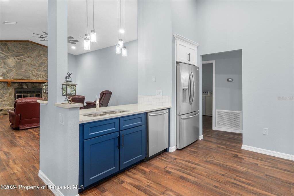 Fireplace, Interior, Kitchen, Pendant Lights, Stainless Steel Appliances, Wood Texture Flooring