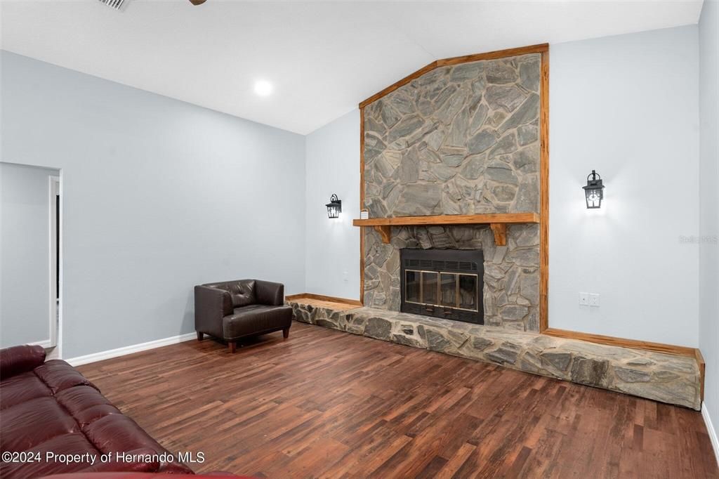 Fireplace, Interior, Recessed Lighting, Stone Walls, Wood Texture Flooring