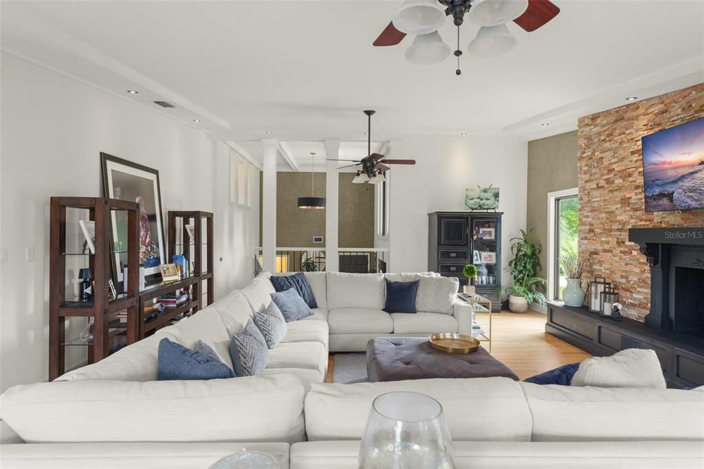 Fireplace, Interior, Living room, Recessed Lighting, Stone Walls, Wood Texture Flooring