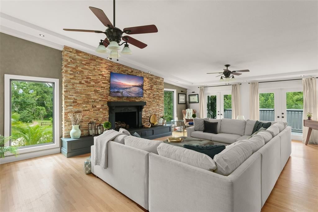 Fireplace, Interior, Living room, Recessed Lighting, Stone Walls, Wood Texture Flooring