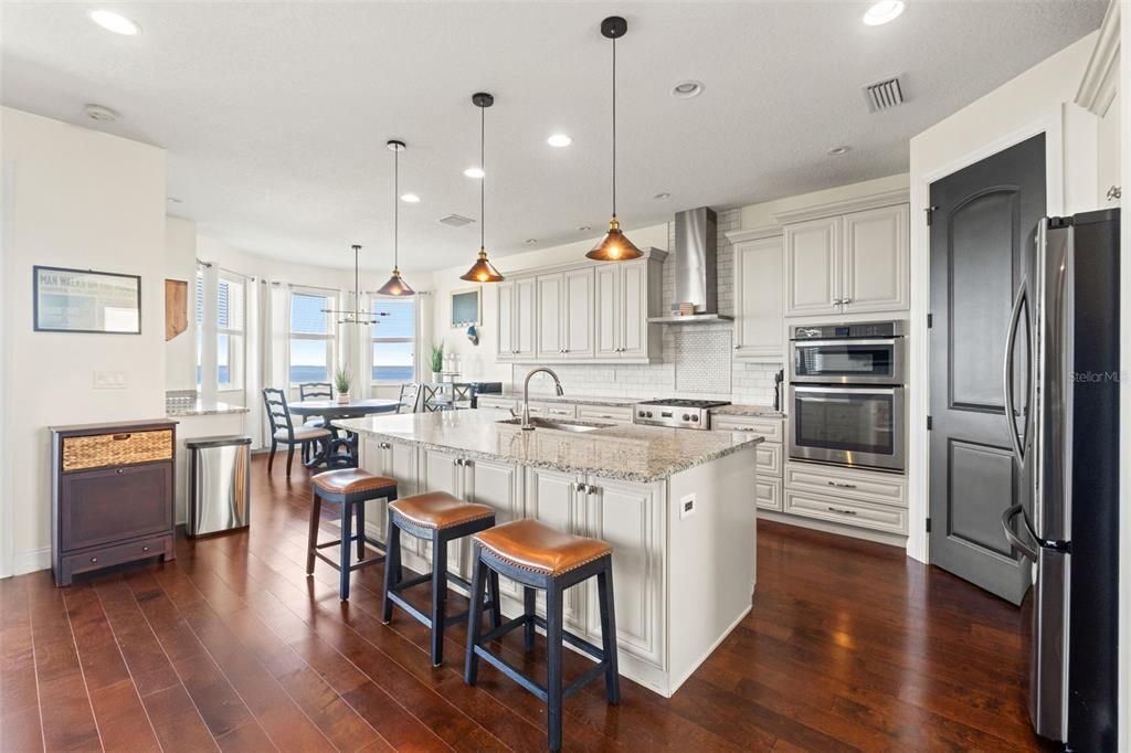 Dining room, Interior, Kitchen, Pendant Lights, Recessed Lighting, Stainless Steel Appliances, Water, Wood Texture Flooring