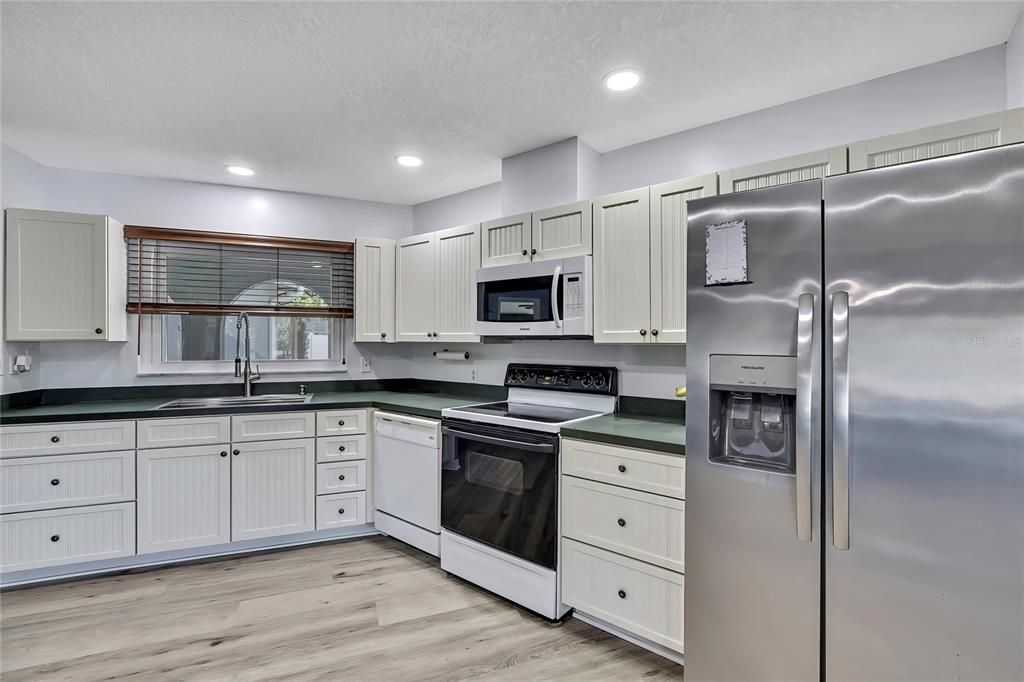Interior, Kitchen, Recessed Lighting, Stainless Steel Appliances, Wood Texture Flooring