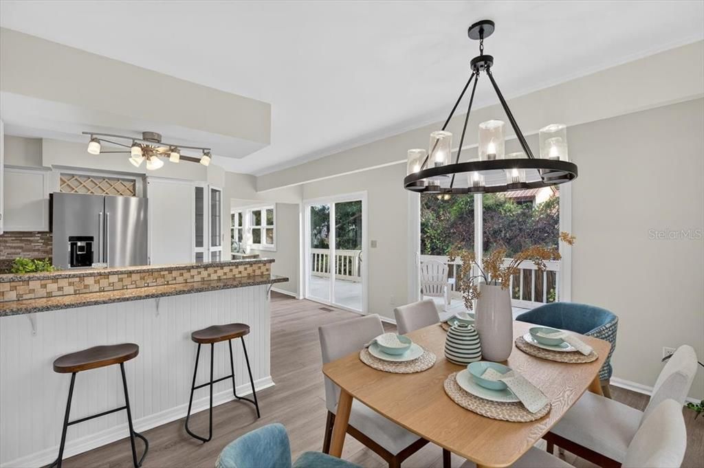 Chandelier, Dining room, Interior, Kitchen, Pendant Lights, Stainless Steel Appliances, Wood Texture Flooring