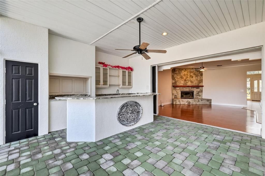 Fireplace, Interior, Kitchen, Recessed Lighting, Stone Walls, Wood Texture Flooring