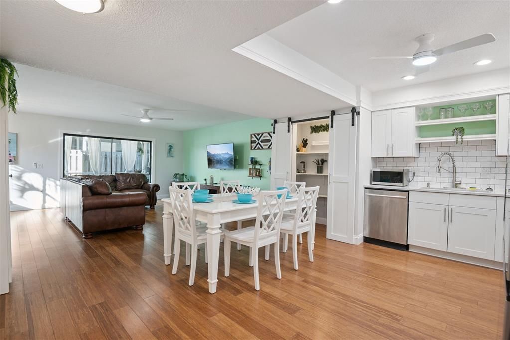 Dining room, Interior, Kitchen, Recessed Lighting, Stainless Steel Appliances, Wood Texture Flooring