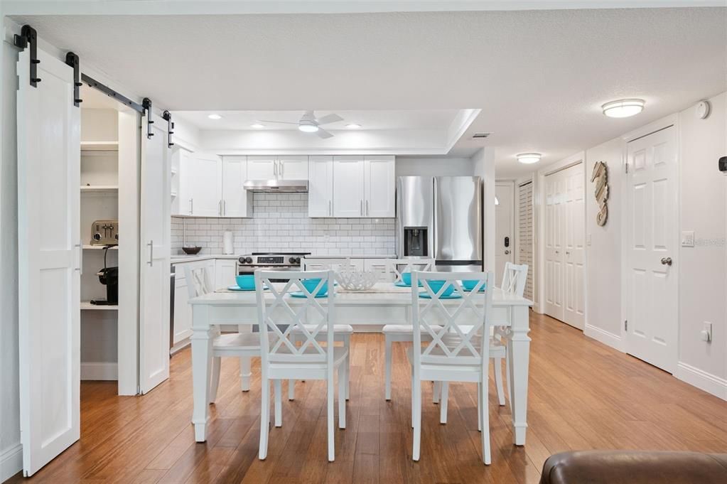 Dining room, Interior, Kitchen, Recessed Lighting, Stainless Steel Appliances, Wood Texture Flooring