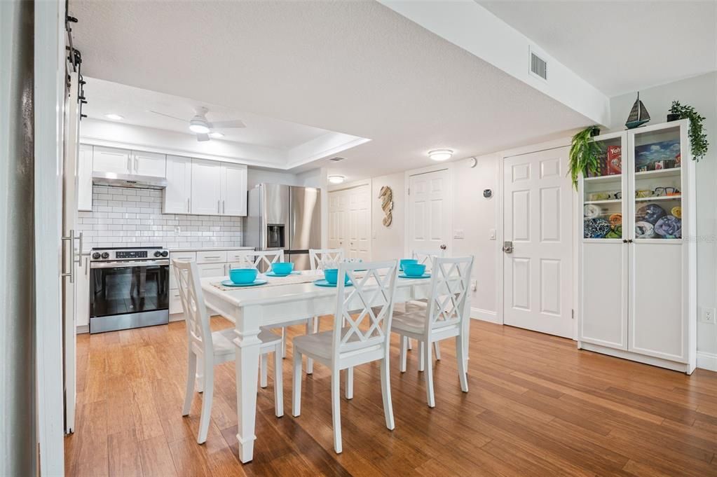 Dining room, Interior, Kitchen, Recessed Lighting, Stainless Steel Appliances, Wood Texture Flooring