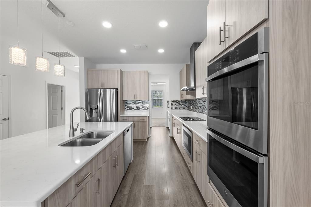 Interior, Kitchen, Pendant Lights, Recessed Lighting, Stainless Steel Appliances, Wood Texture Flooring