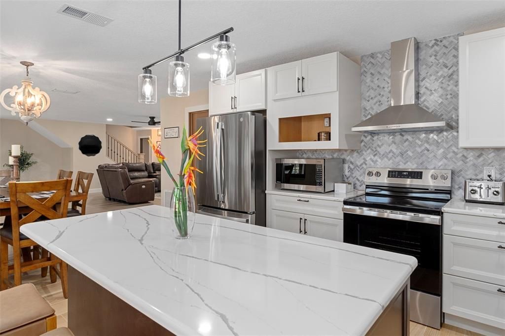 Dining room, Interior, Kitchen, Pendant Lights, Recessed Lighting, Stainless Steel Appliances, Wood Texture Flooring
