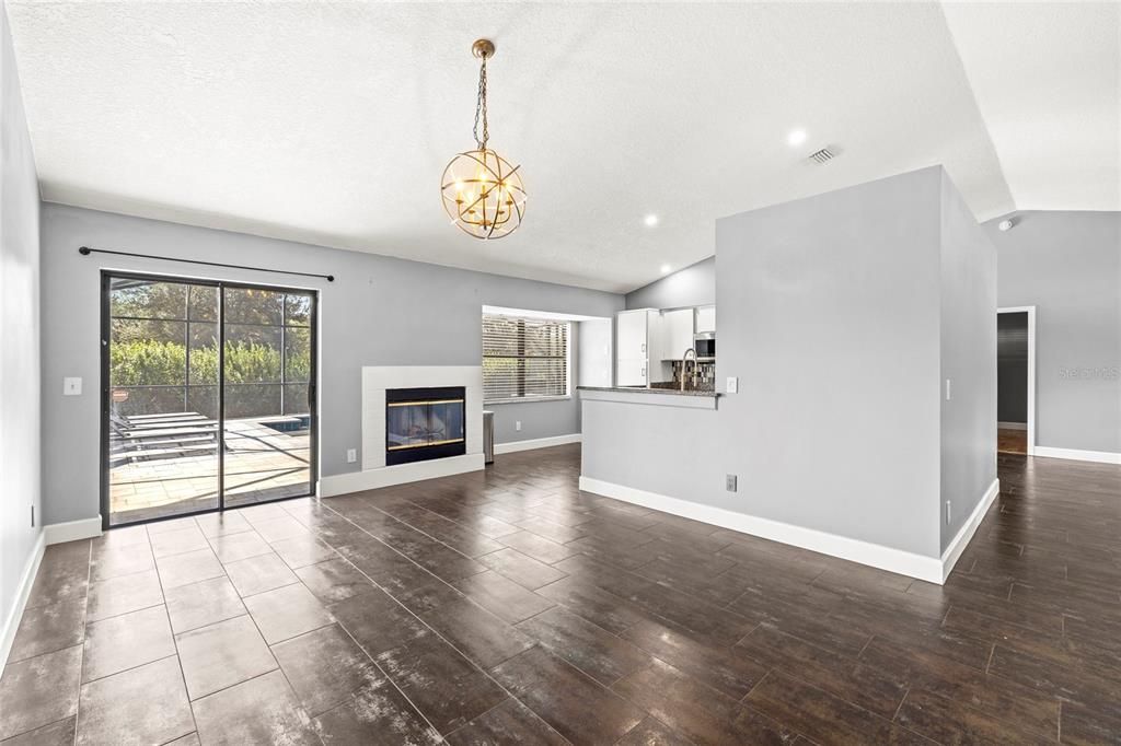 Empty room, Fireplace, Interior, Pendant Lights, Recessed Lighting, Wood Texture Flooring