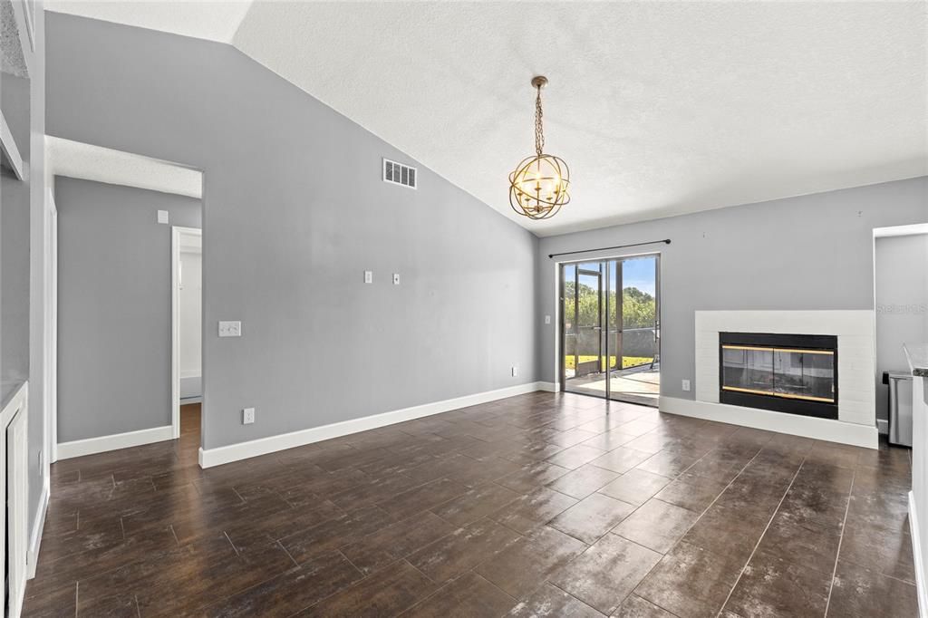 Empty room, Fireplace, Interior, Pendant Lights, Wood Texture Flooring
