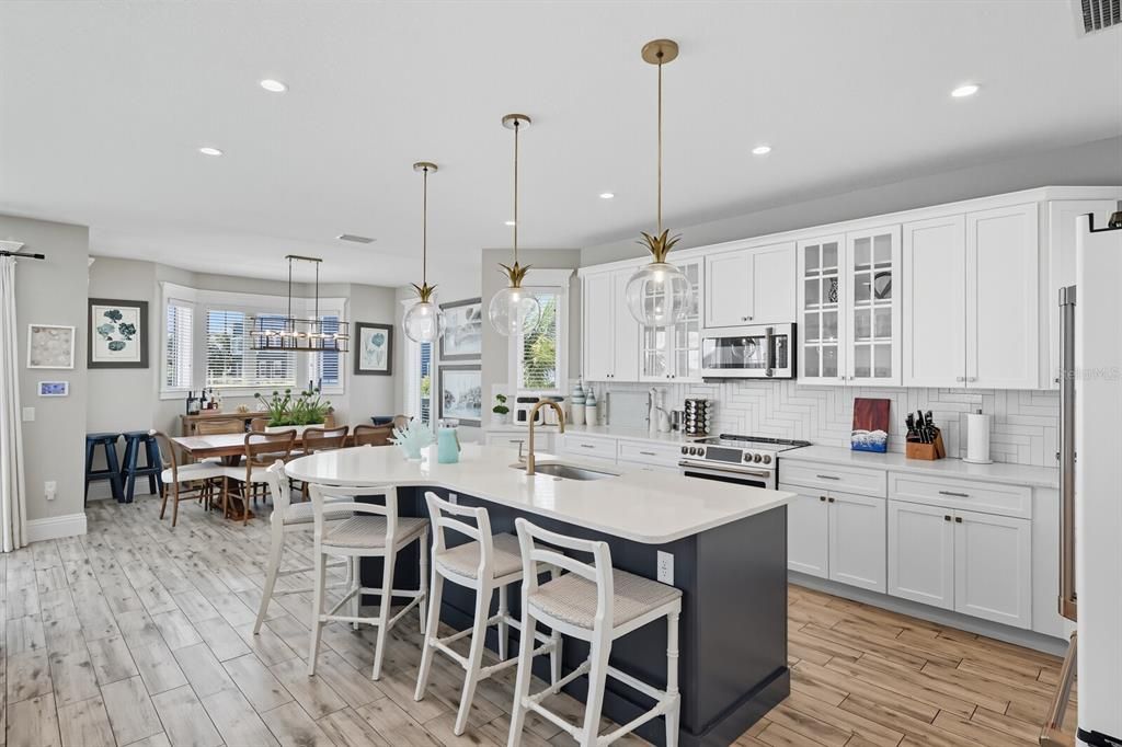 Dining room, Interior, Kitchen, Pendant Lights, Recessed Lighting, Stainless Steel Appliances, Wood Texture Flooring