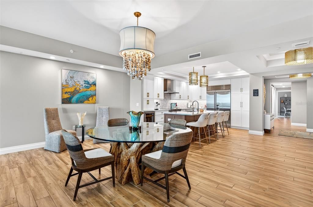 Chandelier, Dining room, Interior, Kitchen, Pendant Lights, Recessed Lighting, Stainless Steel Appliances, Wood Texture Flooring