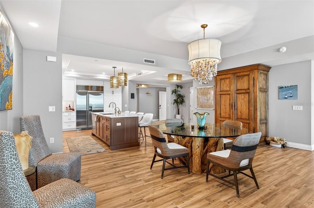 Chandelier, Dining room, Interior, Kitchen, Pendant Lights, Recessed Lighting, Stainless Steel Appliances, Wood Texture Flooring