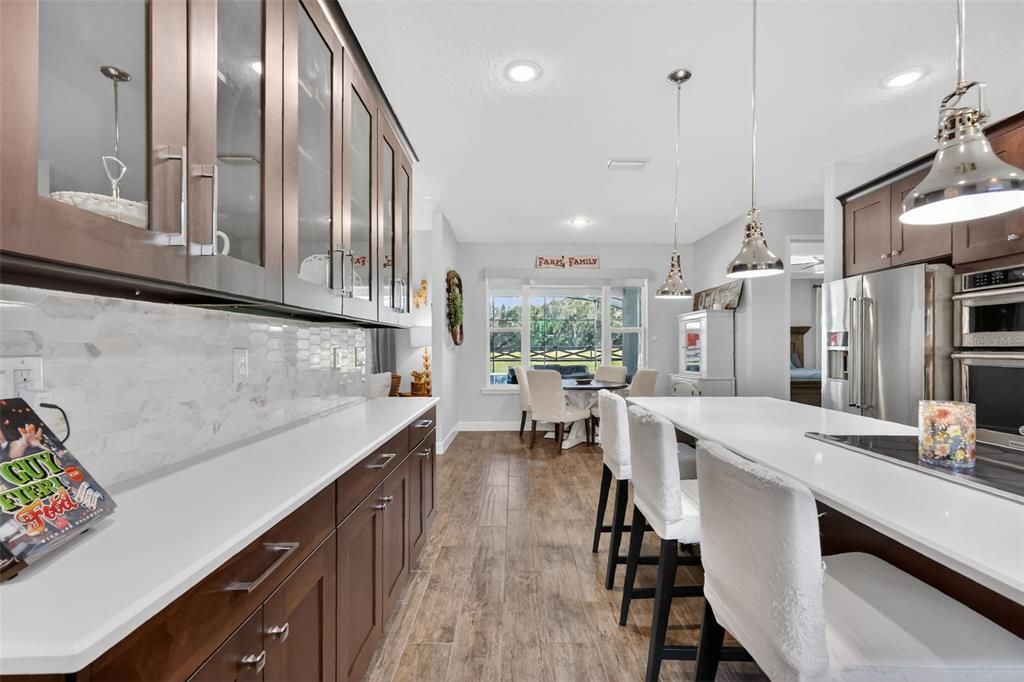 Dining room, Interior, Kitchen, Pendant Lights, Recessed Lighting, Stainless Steel Appliances, Wood Texture Flooring