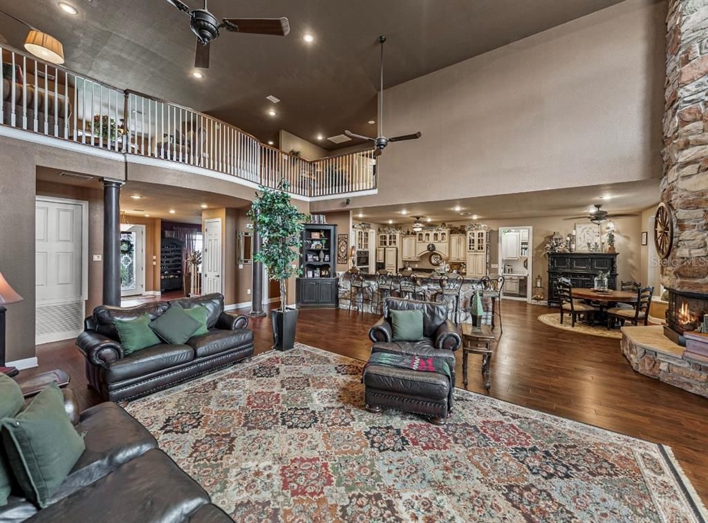 Dining room, Fireplace, Interior, Living room, Recessed Lighting, Wood Texture Flooring