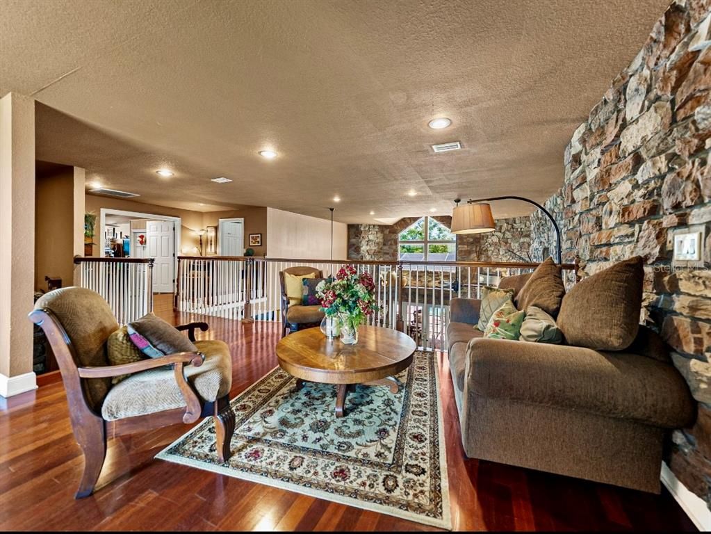 Interior, Living room, Recessed Lighting, Stone Walls, Wood Texture Flooring