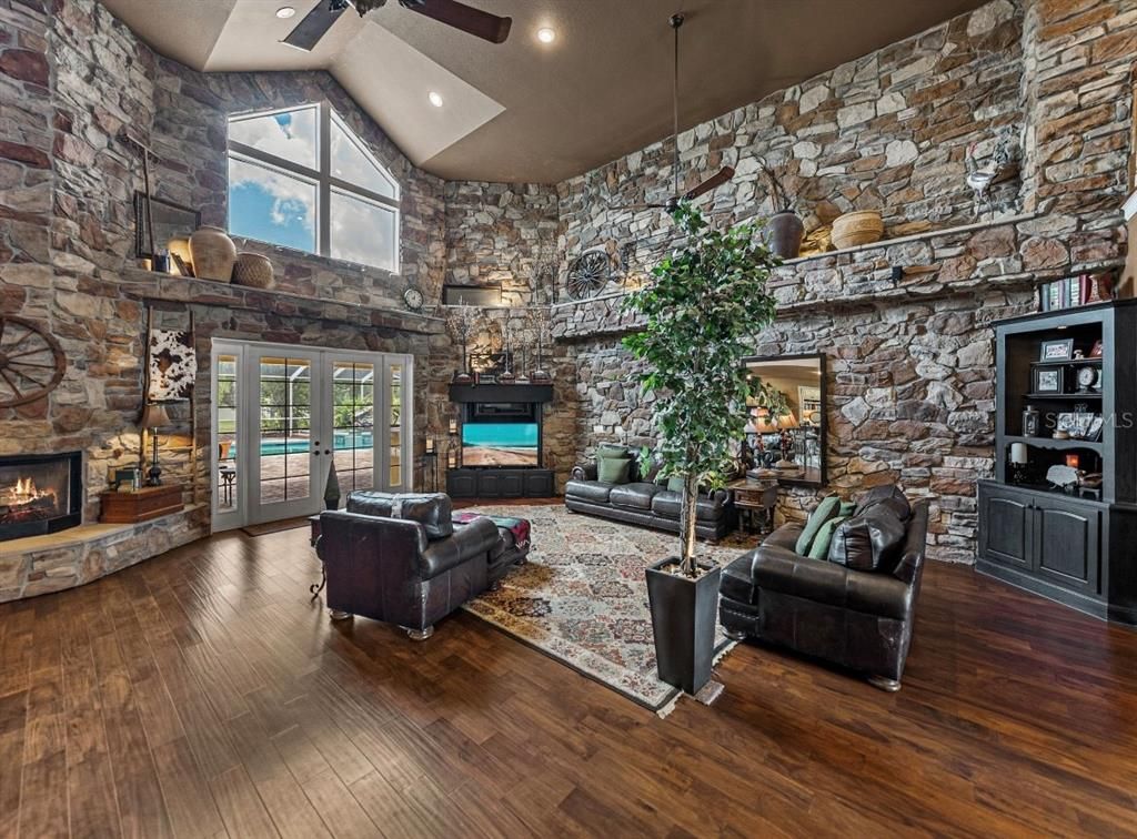 Fireplace, Interior, Living room, Recessed Lighting, Stone Walls, Wood Texture Flooring