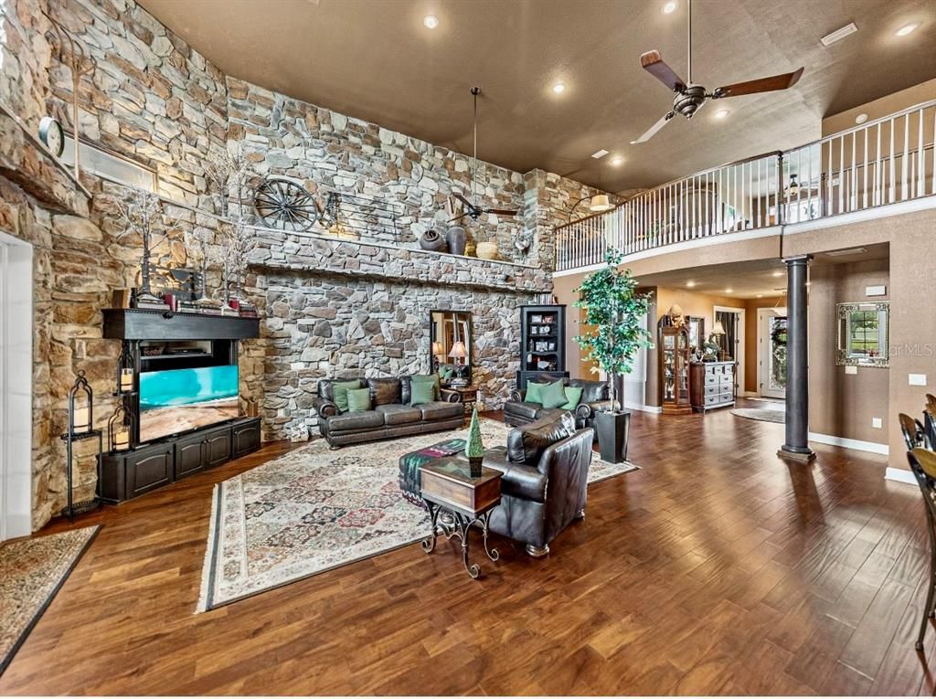 Fireplace, Interior, Living room, Recessed Lighting, Stone Walls, Wood Texture Flooring