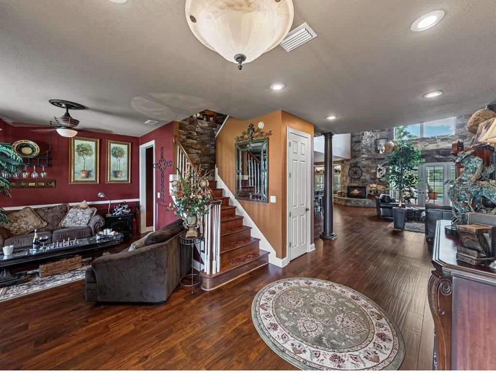 Dining room, Interior, Living room, Recessed Lighting, Stone Walls, Wood Texture Flooring