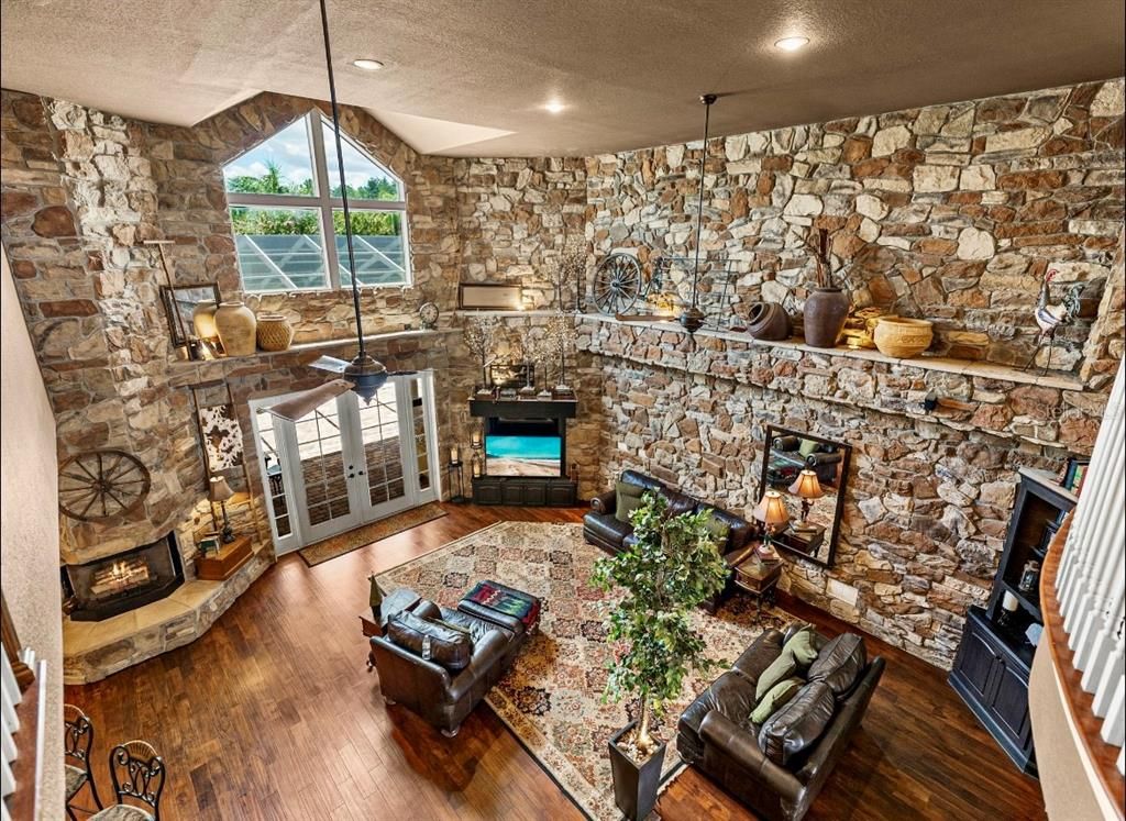 Fireplace, Interior, Living room, Recessed Lighting, Stone Walls, Wood Texture Flooring