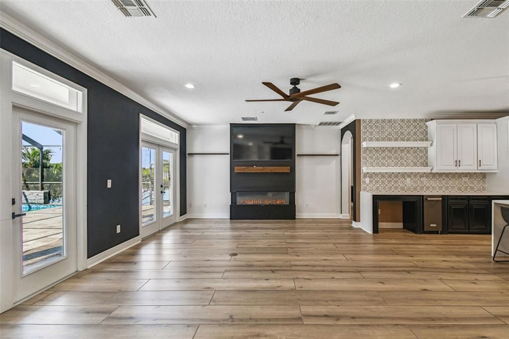 Empty room, Fireplace, Interior, Kitchen, Recessed Lighting, Wood Texture Flooring