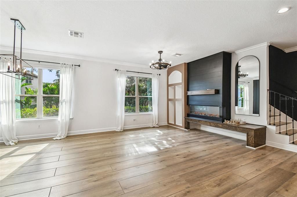 Chandelier, Empty room, Fireplace, Interior, Pendant Lights, Recessed Lighting, Wood Texture Flooring