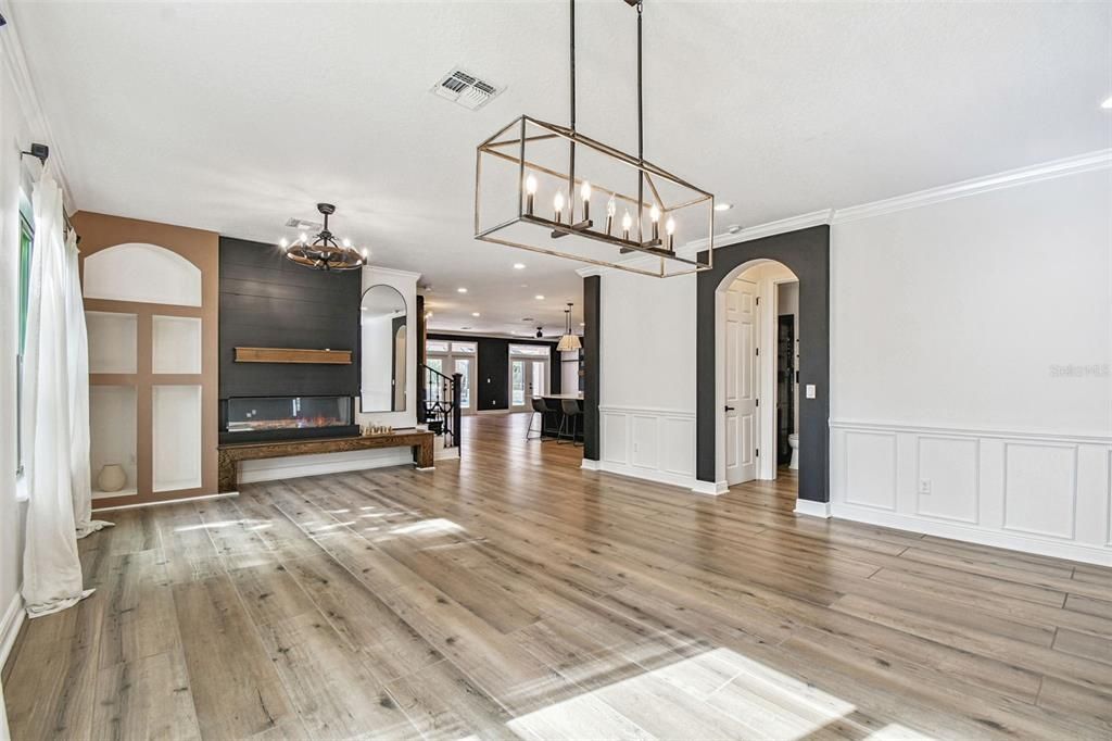 Chandelier, Empty room, Fireplace, Interior, Pendant Lights, Recessed Lighting, Wood Texture Flooring