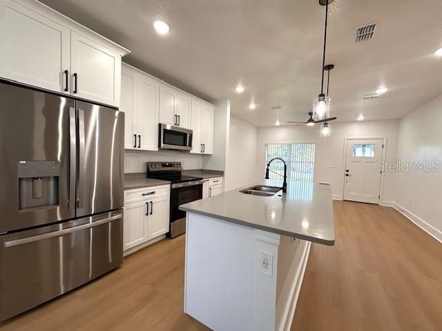 Interior, Kitchen, Pendant Lights, Recessed Lighting, Stainless Steel Appliances, Wood Texture Flooring