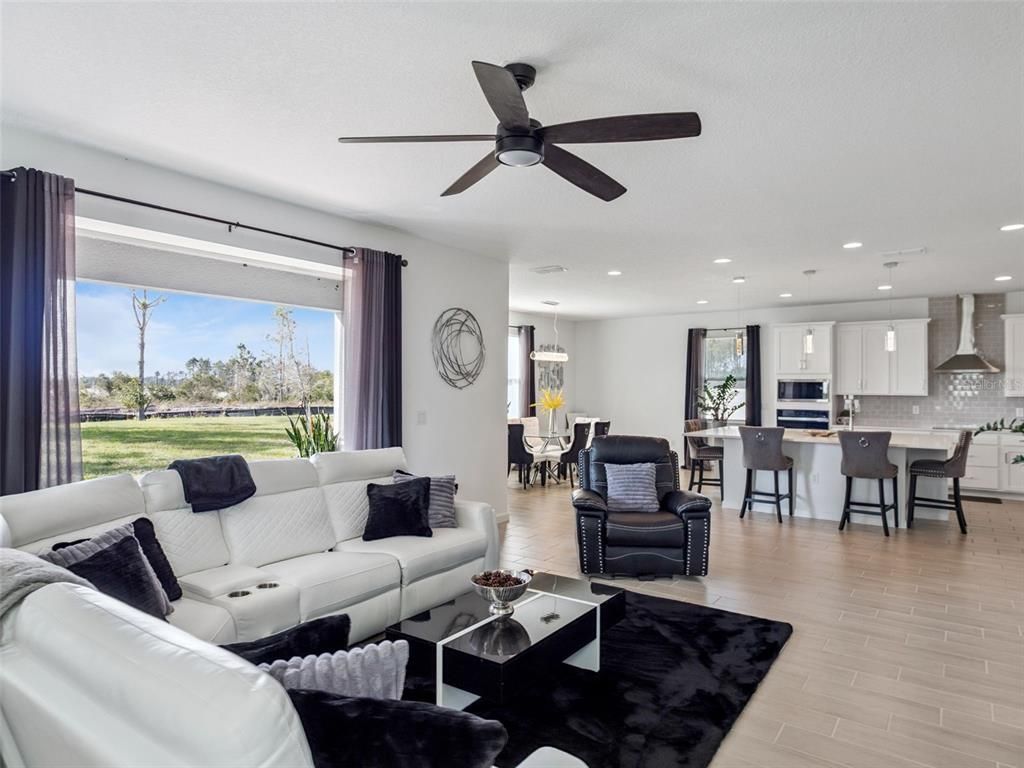 Dining room, Interior, Kitchen, Living room, Pendant Lights, Recessed Lighting, Stainless Steel Appliances, Wood Texture Flooring