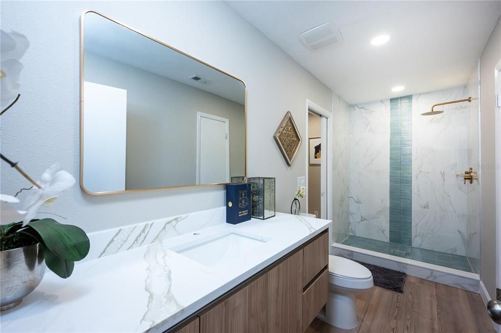 Bathroom, Glass Shower, Interior, Marble Walls, Recessed Lighting, Wood Texture Flooring