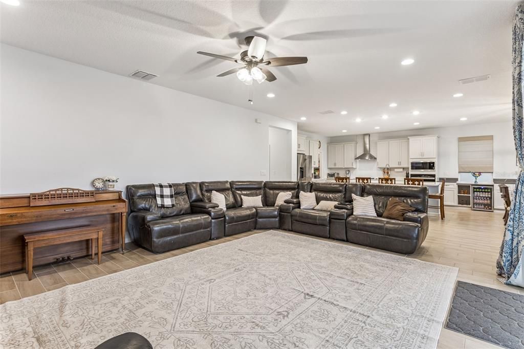 Interior, Kitchen, Living room, Piano, Recessed Lighting, Stainless Steel Appliances, Wood Texture Flooring