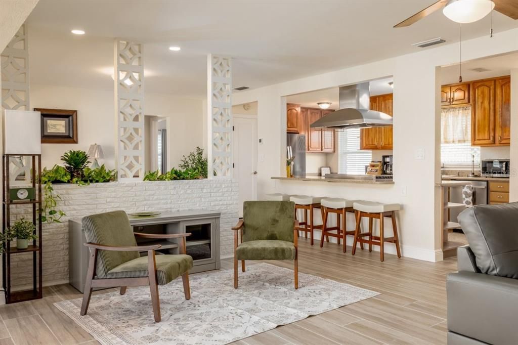 Fireplace, Interior, Kitchen, Pendant Lights, Recessed Lighting, Stainless Steel Appliances, Stone Walls, Wood Texture Flooring