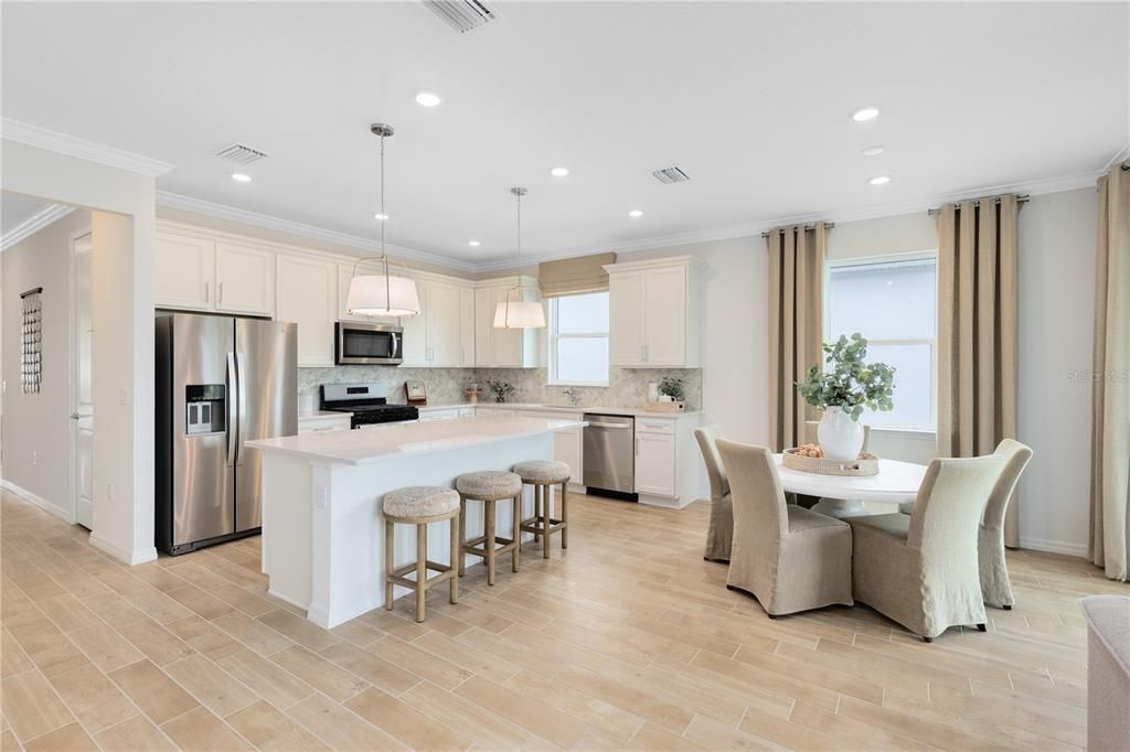 Dining room, Interior, Kitchen, Pendant Lights, Recessed Lighting, Stainless Steel Appliances, Wood Texture Flooring