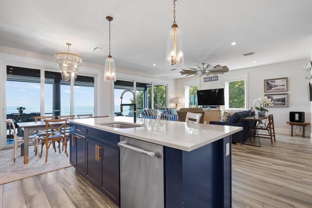 Chandelier, Dining room, Interior, Kitchen, Living room, Pendant Lights, Recessed Lighting, Water, Wood Texture Flooring