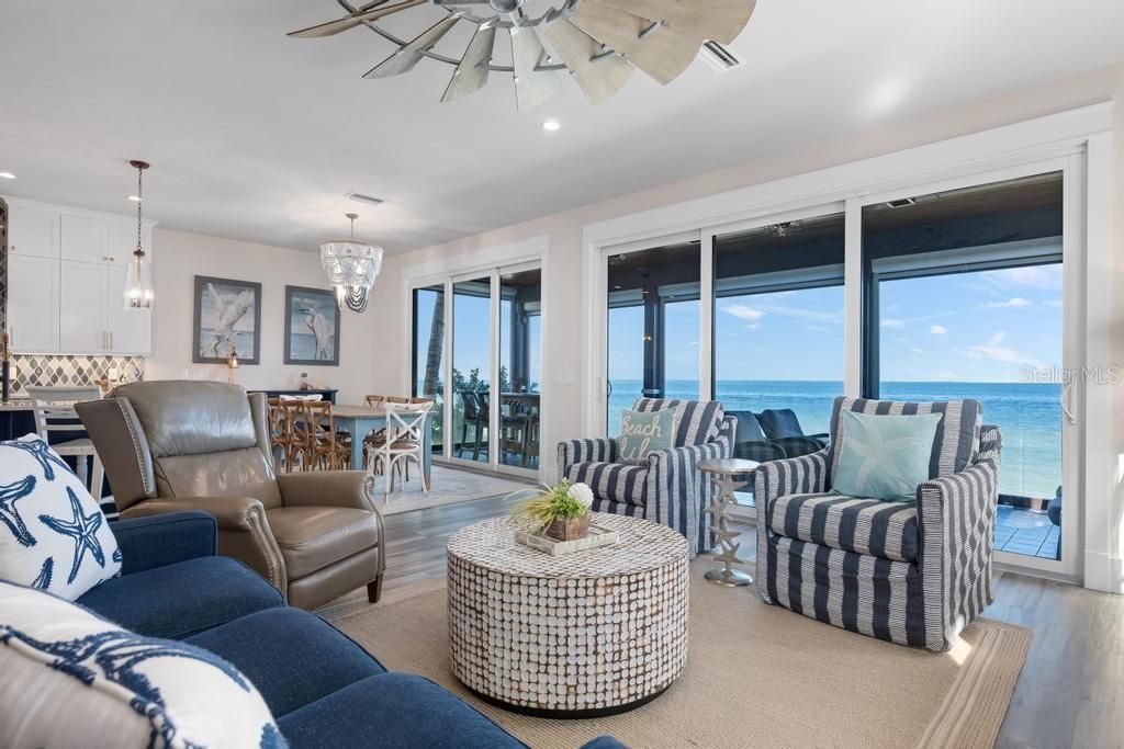 Chandelier, Dining room, Interior, Living room, Pendant Lights, Recessed Lighting, Water, Wood Texture Flooring