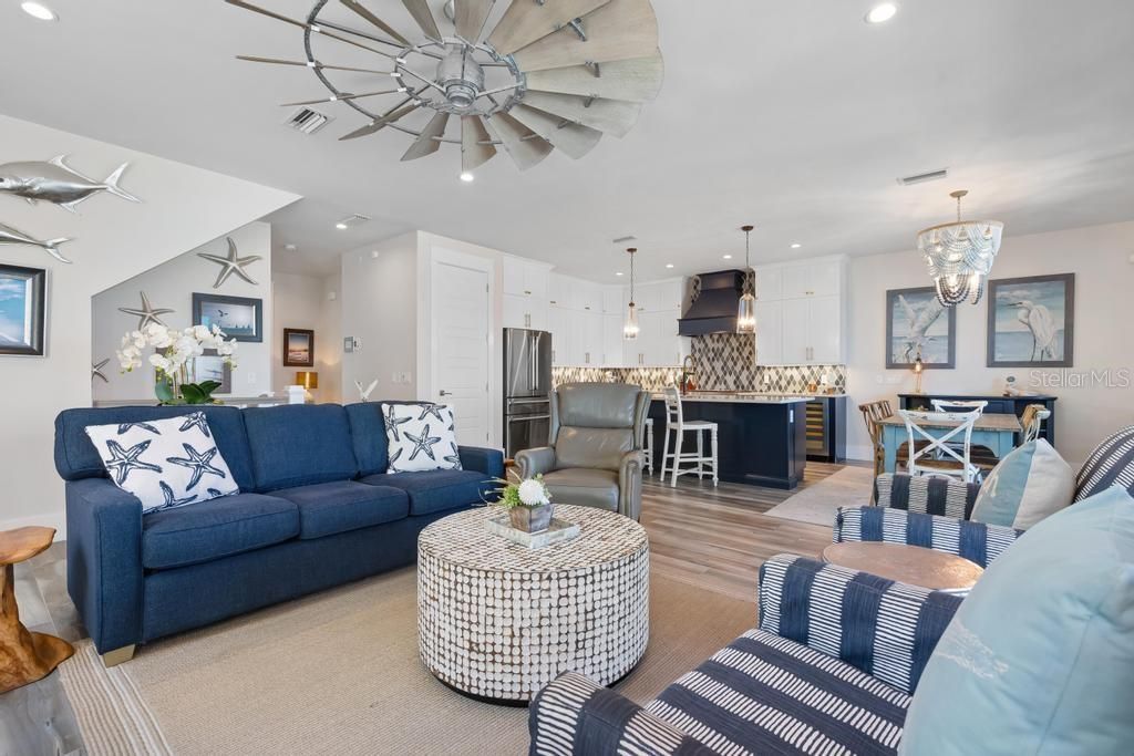 Chandelier, Dining room, Interior, Kitchen, Living room, Pendant Lights, Recessed Lighting, Stainless Steel Appliances, Wood Texture Flooring